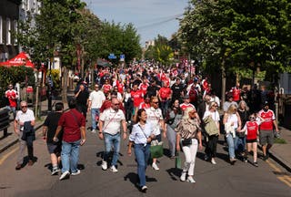 Fans arrive at the stadium